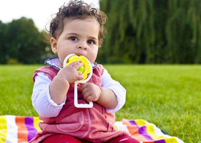 Children picking food or objects into the mouth.